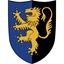 Groot houten speelgoed schild, half  blauw en half zwart, met een staande gele leeuw.
