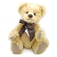 Lichtgele mohair Clemens Teddy Beer van 36 cm met een grote bruin geruite strik.